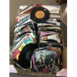 A box of 7 inch singles by various artists from th