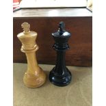 A wooden chess set fitted in mahogany box .