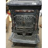 An enamel cast iron and marble French stove heater.