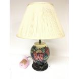 A modern Moorcroft table lamp with shade.