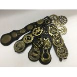 A collection of horse brasses with leather martingales to include Masonic examples.