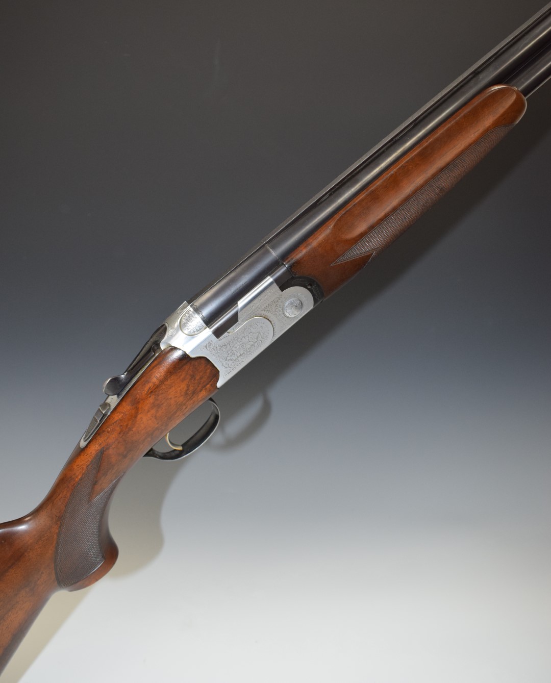 Beretta 686 Special 12 bore over and under ejector shotgun with with all over floral engraving,