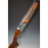 Lincoln 12 bore over and under ejector shotgun with engraved scenes of dogs and birds to the lock,