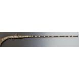 Turkish, Ottoman or Middle Eastern flintlock jezail or similar gun with white metal decoration,