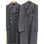 Two Royal Air Force great coats with buttons and insignia