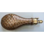 G & JW Hawksley copper and brass powder flask with embossed basket weave decoration, 21cm long