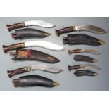 Six kukri knives, two with GK & Co to ricasso, all with sheaths, largest blade 27cm. PLEASE NOTE ALL