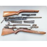 A collection of BSA and other air rifle parts including stocks, springs, barrels, scope etc.