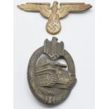 Two German WW2 Third Reich Nazi badges, Tank Assault badge stamped AS to back, together with a Eagle