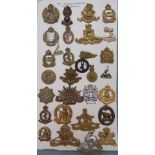 Thirty Commonwealth metal badges including Australian Tank Corps, Royal Australian Regiment, 1st