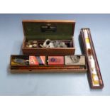 Three shotgun cleaning kits comprising one William Powell & Son with snapcaps and oil bottle in