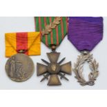 Three French WW1 medals comprising Croix de Guerre with laurel leaf emblem, Ordre de Palmes