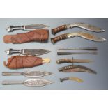 Two kukri knives, blade length 30cm, two tribal knives in sheaths, spear heads etc. PLEASE NOTE