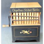 Orgelbau Stuber Berlin paper roll organ, with eight music rolls, two test rolls and two monkeys,