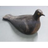 A 19thC painted plaster pigeon decoy with inset glass eyes, 33cm long.