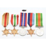 British Army WW2 medals comprising 1939-1945 Star, Africa Star, Italy Star, Defence and War