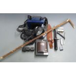 A collection of gun and shooting related items including Nightsearcher 750, Rambo First Blood
