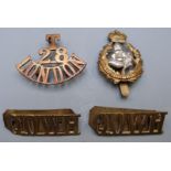 British Army Queen's Own Worcestershire Hussars cap badges and a pair of shoulder titles, together