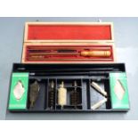 Parker Hale shotgun cleaning kit together with a rifle cleaning kit in fitted wooden box and a