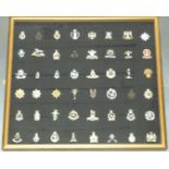 Forty-eight British Army cap badges including Blues and Royals, Royal Scots Greys, Royal Hussars,