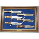 A set of six Franklin Mint Bowie knives, including 'The Trapper' and The Gold Rush' examples, all