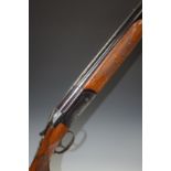 Valmet 12 bore over and under shotgun with pattern engraved locks, single trigger, chequered and