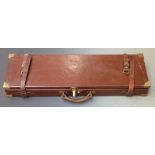 Leather or similar bound gun case with fitted interior, brass lock and corners and 'William Powell &