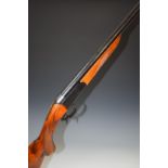 Baikal12 bore single barrelled shotgun with engraved animal scenes to the lock, chequered semi-