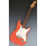 Fender Stratocaster electric guitar c1997, California series in 'Fiesta red'/ salmon lacquer