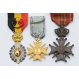 Two Belgium medals comprising Industrial Labour Medal and Croix de Guerre, together with a Serbian