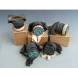 Five cased civilian gas masks