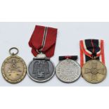 Four German WW2 Third Reich Nazi medals comprising Sudetenland Medal, War Service Medal of Merit,