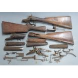A collection of shotgun parts including centrefire actions, W Singer of Cardiff pinfire action,