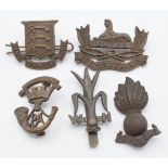 Five British Army Officer's Service Dress badges including Welsh Horse, Essex Regiment, Somerset