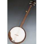 A five string banjo of Japanese manufacture with steel reinforced neck