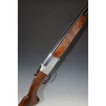 Italian 20 bore over and under shotgun with engraved lock, underside and top plate, chequered semi-