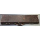 Leather bound gun case with fitted interior and brass lock, 82x23x8cm.