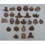 Approximately twenty five British Army Officer's Service Dress, cap and collar badges including