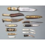 Twelve knives including a Franklin Mint example, two with sheaths, five other penknives etc, largest