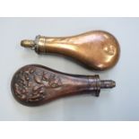 Two copper and brass powder flasks, one G & J W Hawksley the other with embossed decoration of birds