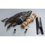 A falconry lure together with 12 bore shotgun snap caps and a forend hand protector.