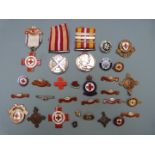 Red Cross and St John Ambulance Brigade medals and badges including a Voluntary Medical Service