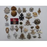 Twenty-seven British Army badges including 8th Battalion King's Liverpool Regiment (Firmin, London),