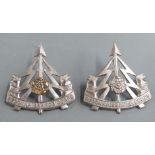 Two British Army Reconnaissance Corps West Riding Division metal cap badges