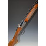 Domino12 bore over and under ejector shotgun with engraved lock, trigger guard, underside, top plate