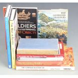 Eleven military related books including 'The Glorious Glosters' by Tim Carew, 'The War in Korea'