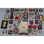 Collection of British Army cloth badges, divisional patches including 30th Corps, 4th Armoured
