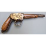 11mm brass framed Martini action pistol with deeply engraved frame, shaped underlever, grips and