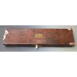 Charles Fisher leather bound gun case with fitted interior, brass lock and name plate, embossed