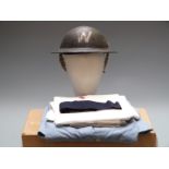 WW2 Home Front warden's steel helmet with liner and chin strap and a vintage nurse's uniform